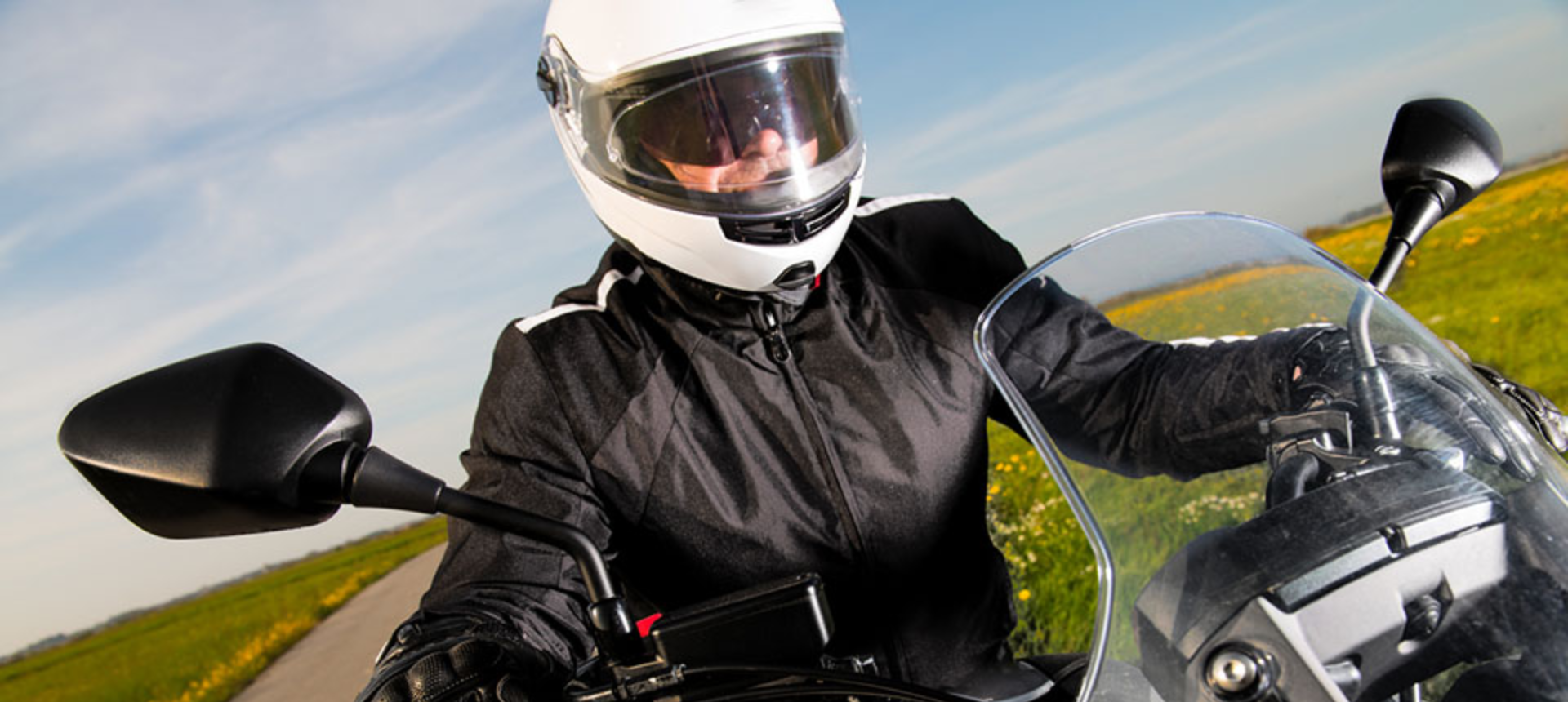 Close up of rider on motorcycle wearing a new jacket.