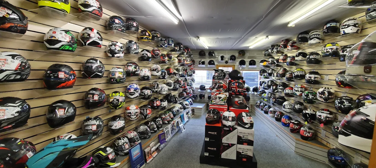 Motorcycle helmets on display in the RaceLeathers helmet room in Darwen, Lancashire
