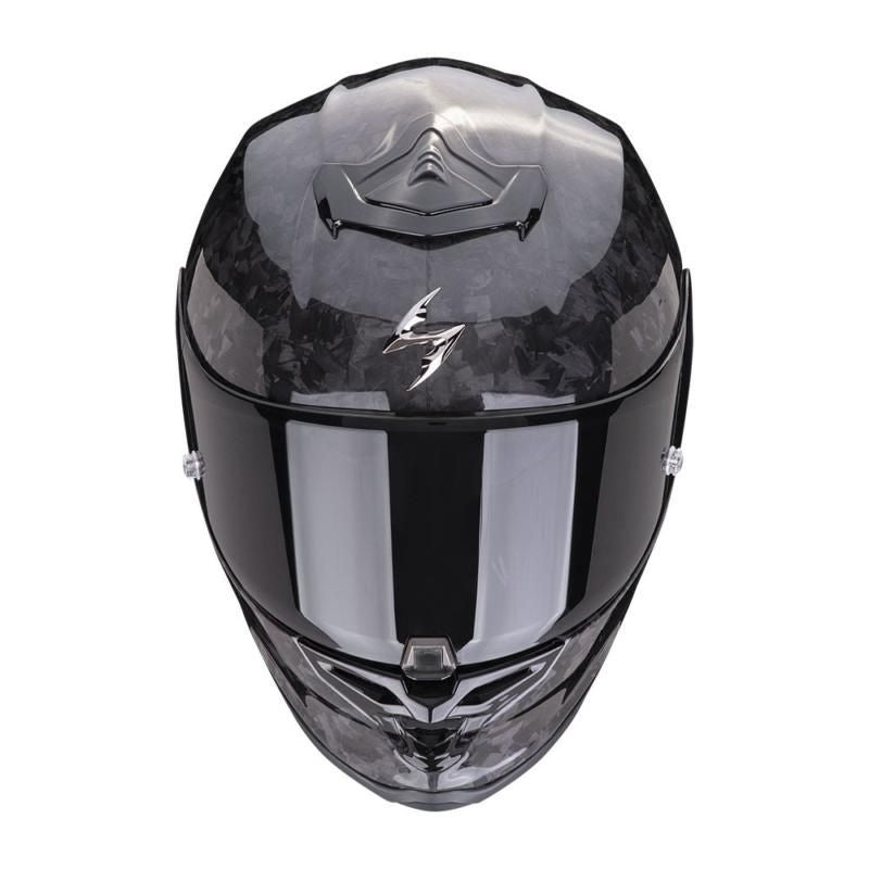 Black motorcycle helmet with a reflective visor on a white background