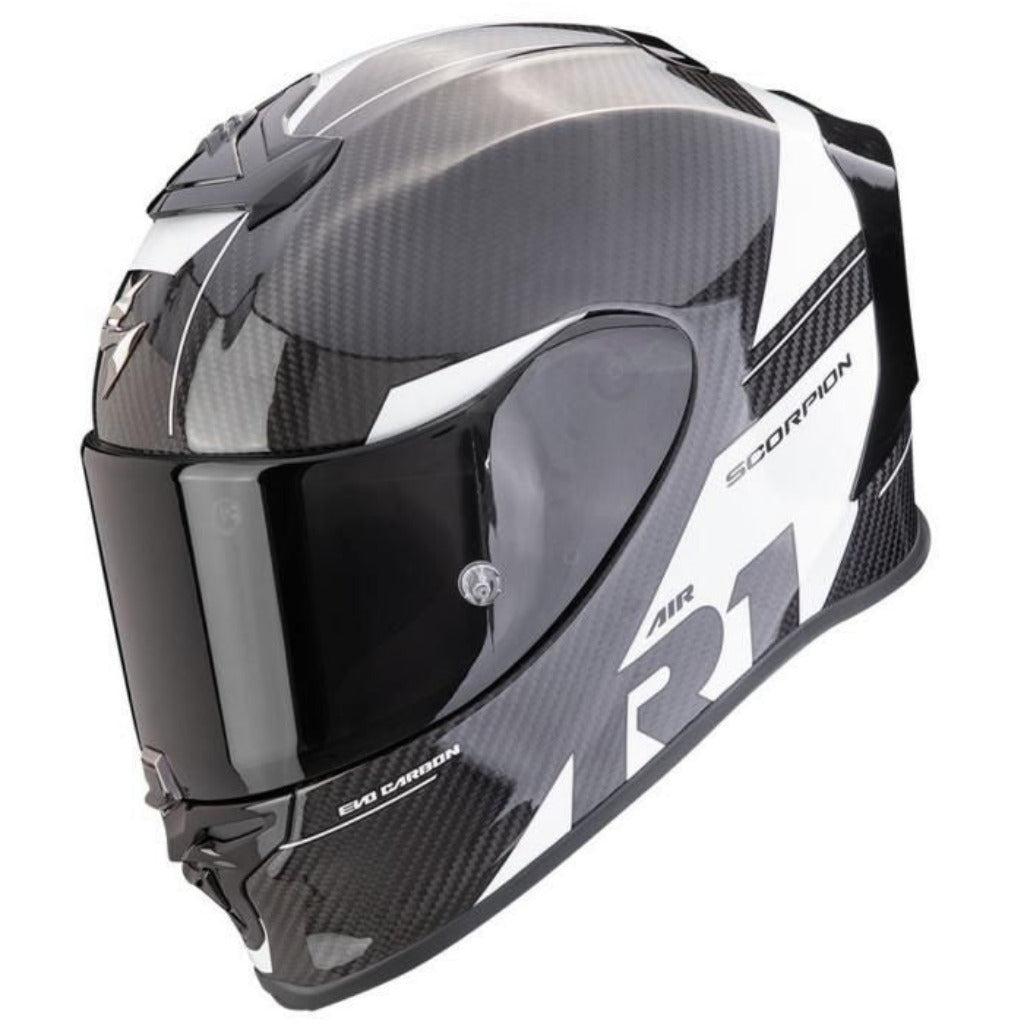 A carbon fiber full-face motorcycle helmet in black and white with a dark visor, featuring the 'R1' and 'SCORPION' branding on a clean white background.