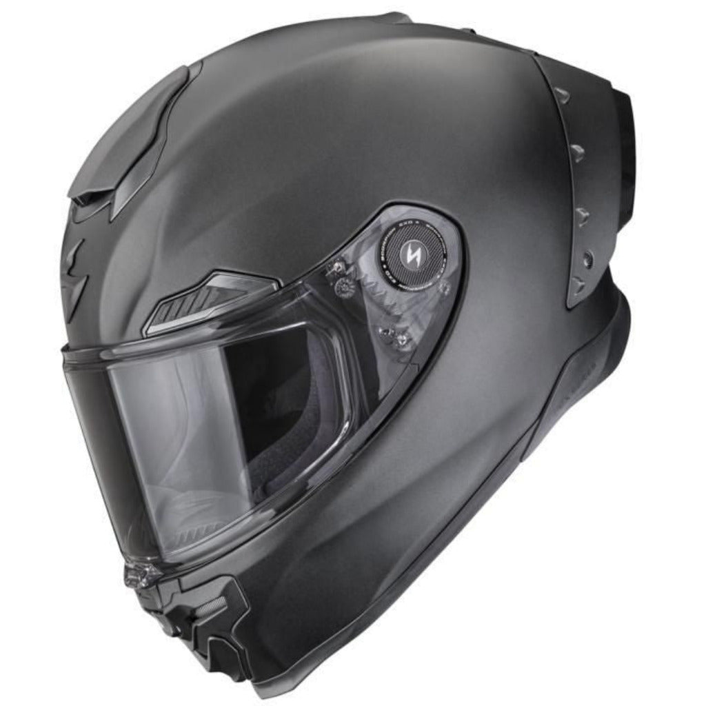 Black motorcycle helmet with clear visor on a white background