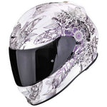 Motorcycle helmet with floral and feather design on a white background