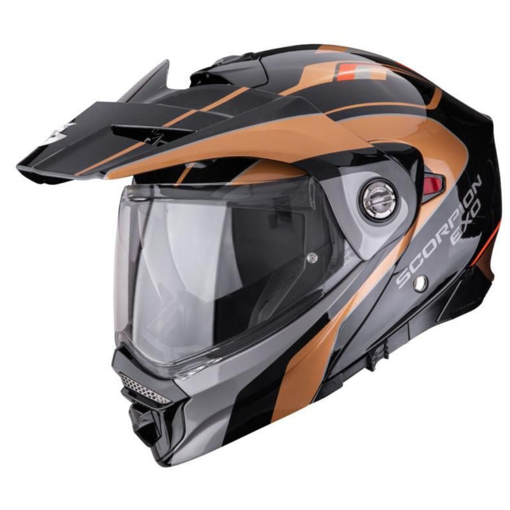 Black and orange motorcycle helmet with visor on a white background