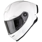 White motorcycle helmet with clear visor on a white background