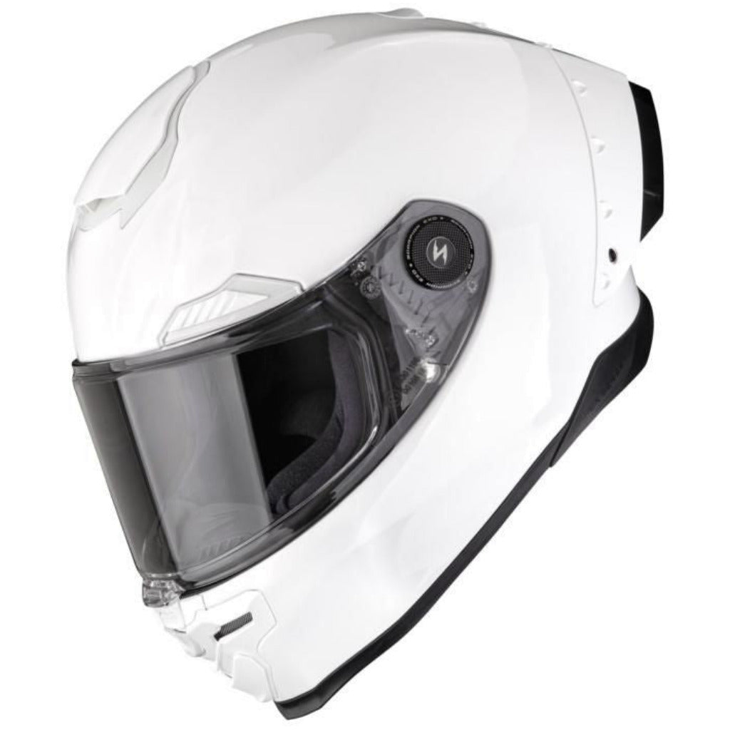 White motorcycle helmet with clear visor on a white background
