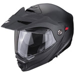 Black motorcycle helmet with clear visor on a white background