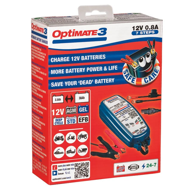 Optimate 3 12V 0.8A 7 Steps battery charger in its retail packaging, featuring a red box with blue and white text and graphics of the blue battery charger and red clamps.