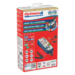 Optimate 4 Quad Program battery charger retail box, featuring a red and white package design with blue and yellow accents, showcasing the multicolor device and safety icons.