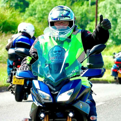 Biker riding at motorcycle event.