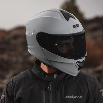 Main stood up wearing full face helmet.