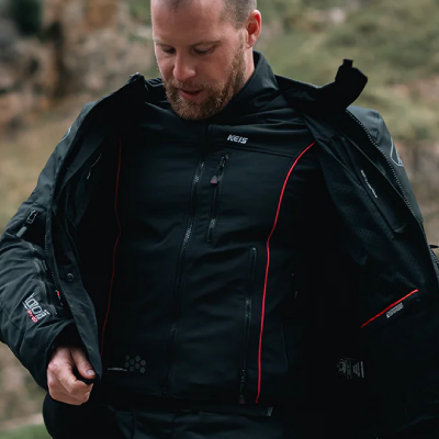 Rider putting on heated motorcycle jacket.