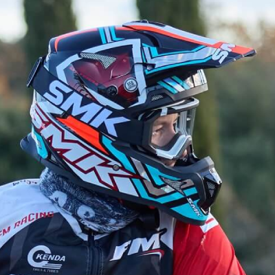 Person wearing full face motocross off road helmet.