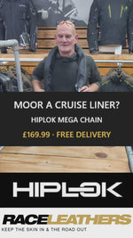 Keith from RaceLeathers Motorcycle Clothing demonstrating the Hiplok Mega Chain at the store in Darwen Lancashire