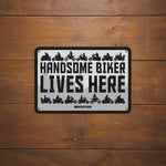 Oxford Garage Metal Sign: Handsome Biker Lives Here