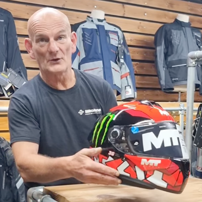 Keith at RaceLeathers reviewing helmet in store.